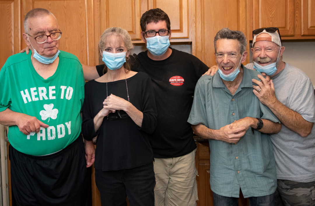 Group of happy people in a kitchen